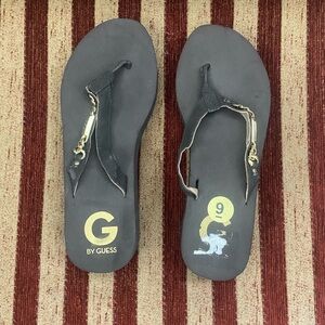 NWOT G by Guess chocolate brown wedge flip flops with gold Guess detail. Size 9